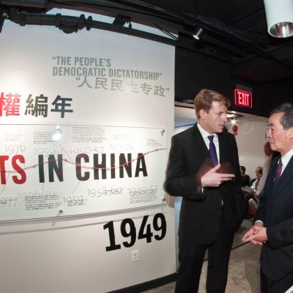 Harry Wu greets guests before the ceremony begins